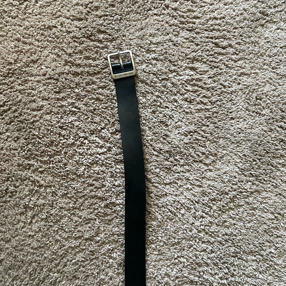 Calvin Klein ladies black leather belt with silver buckle. NWOT